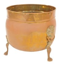 A Victorian copper and brass log bucket, of globular form with raised rim, with two lion's head ring