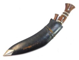 A Nepalese or Indian Kukri, with wooden handle, curved steel blade, together with the karda and chak