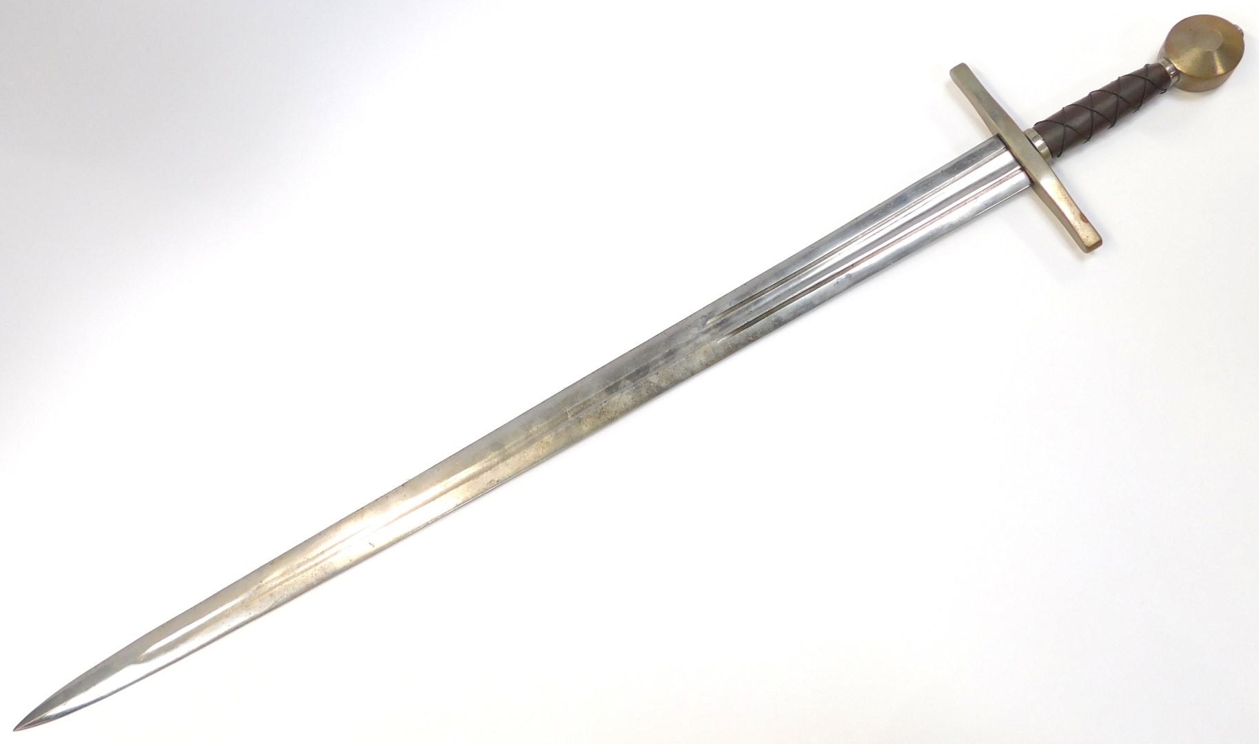 A replica medieval broad sword, with circular pommel, brown leather grip with twisted wirework cross - Image 2 of 3