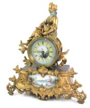 A 19thC French style mantel clock, the circular dial bearing Roman numerals above a painted panel of