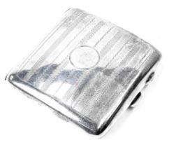 A George V silver cigarette case, with engine turned engraved decoration, striped design with a circ