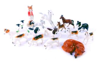 A group of Beswick pottery animals, comprising hunting scene dogs, foal, a fox, dapple grey foal and