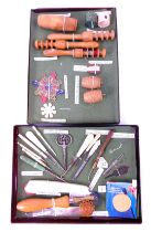 A group of sewing implements, to include cotton thread winders, a cotton reel holder modelled as a b