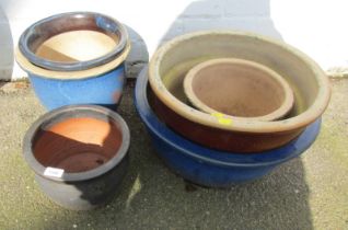 A group of garden pots, to include a blue glazed example, 46cm diameter. (a quantity)