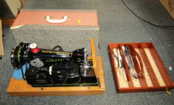 A Zenith electric cased sewing machine, with pedal, and a small amount of silver plated cutlery. (2)