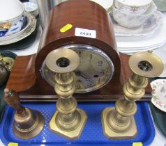 An early 20thC mahogany cased Napoleon hat mantel clock, the brass circular dial bearing Roman numer