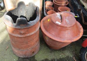 A terracotta chimney pot, 47cm high, (AF), together with a bread crock. (2)