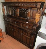 A 20thC oak court type cupboard, 138cm high, 135cm wide, 46cm deep.