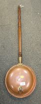 A 19thC copper warming pan with lion mask ring handle.