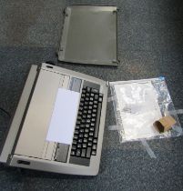 A Panasonic electric typewriter, model KXR190, with instruction book.