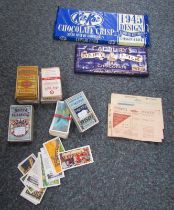 A small group of Players Navy Cut cigarette cards, a Cadbury's Dairy Milk chocolate bar in the 1945