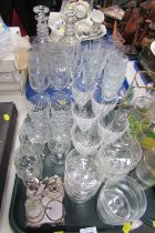 A group of glassware, comprising two pressed and moulded glass decanters, sundae dishes, silver plat