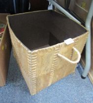 A storage basket, with animal hide type finish.