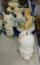 A Noddy teapot, commemorative pins, cabinet plate, butter dish, side plates, piggy bank, etc. (1 tra