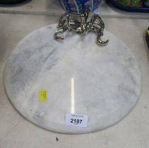 A circular white marble cheese board, with a cast metal octopus to top, 30cm diameter.