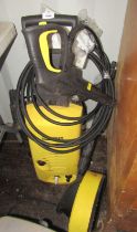 A Karcher pressure washer, with attachments, etc.