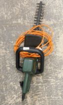 A Black and Decker GT221 electric hedge trimmer.