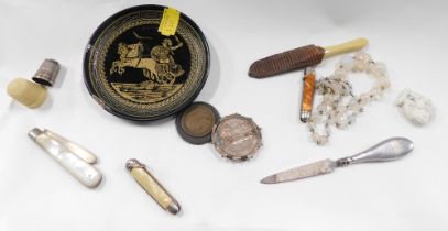 A group of trinkets and effects, comprising a mother of pearl and silver handed penknife, a 1902 coi
