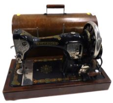 A cased Hexagon sewing machine with Moisers Freeman Grimsby label.