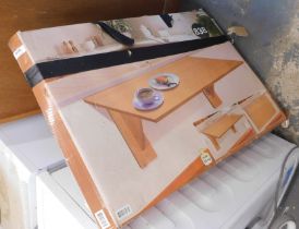 A modern beech effect coffee table, flat pack boxed.