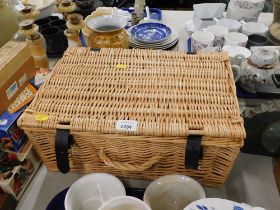 A wicker picnic hamper.