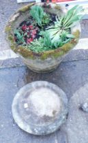 A reconstituted stone circular planter and a bird bowl. (2)