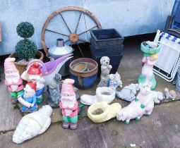 A group of garden statuary, comprising painted gnomes, pig in thong, tortoise, boots, plastic pots,