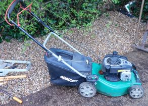 A Qualcast 450E petrol lawnmower.