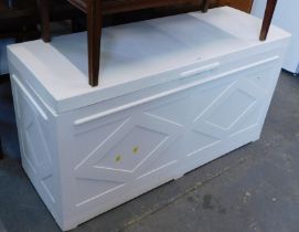 A white plastic garden storage chest.