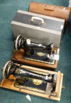 Two cased Singer sewing machines. (2)