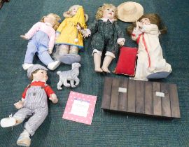 A group of Ashton Drake and Leonardo Collection dolls, each on stands, loose. (1 box)