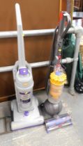 A Dyson ball vacuum cleaner, and a Vax upright vacuum cleaner. (2)