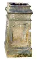 A 19thC reconstituted stone and painted chimney pot, on square foot, 68cm high, the top 33cm x 33cm.