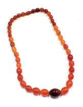 An imitation amber necklace, 54cm long.