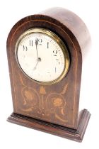 An Edwardian walnut mantel clock, the domed top with a white enamel numeric dial, with boxwood tulip