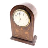 An Edwardian walnut mantel clock, the domed top with a white enamel numeric dial, with boxwood tulip
