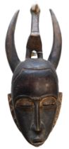 A Baule divination or peace mask, Cote D'Ivoire, approx 50 years old, 52cm high.