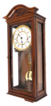 A Committee of London mahogany cased drop dial wall clock, with a white enamel Roman numeric dial, a