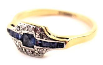 An Art Deco sapphire and diamond dress ring, the central sapphire panel set with square and rectangu