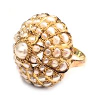 A pearl dress ring, the natural white lustre pearls, in a yellow metal circular setting with scroll