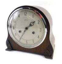 A 1950s Smith's oak cased mantel clock, with silvered dial, 20cm high.