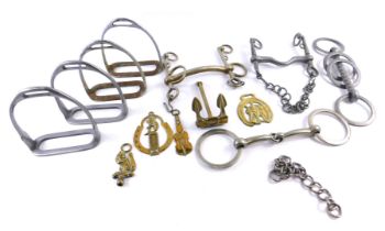 Various plated metal stirrups, horse bits, a brass anchor stamped W Griffin Cradley, Tritan, etc.