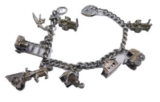 Withdrawn pre-sale. A white metal charm bracelet, stamped 925, 35.7g.