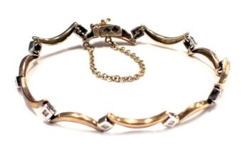 A diamond bracelet, the links formed as arched half moons, with white gold tiny diamond set links, s