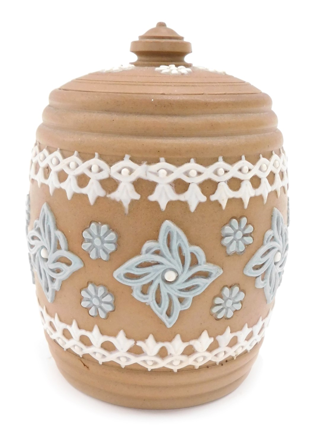 A Doulton Lambeth ginger jar and cover, on a brown ground, with cream and blue flowers, 13cm high.
