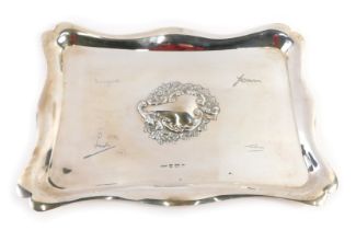 A Edward VII silver embedded serving tray, rectangular form with a fluted border, central vacant car