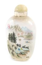 A Chinese glass scent bottle, with painted decoration of mountains and figures, with pale green stop