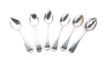 Six silver Victorian and later fiddle pattern serving spoons, comprising a monogrammed near pair bea