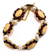 A Lucien Piccard Edwardian style bracelet, formed as oval sections set with cabochon rubies and two