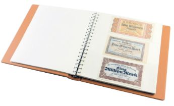 An album containing world banknotes, to include Deutschmarks, British Armed Forces pound notes, Funf